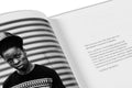 Close-up of the "Faces and Phases" photography book by MACK showing detailed cover art and design.