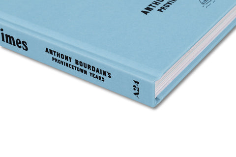 Close-up of the book cover for "Happier, Stupider Times: Anthony Bourdain's Provincetown Years" by A24, showcasing the front design.