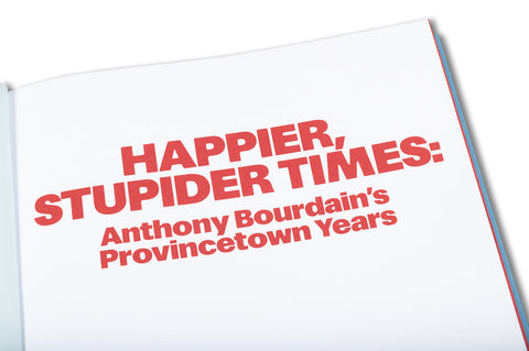 Close-up of the book cover for "Happier, Stupider Times" by Anthony Bourdain, featuring bold typography and vibrant design.