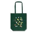 MACK tote bag featuring colorful fruit sticker design, made of durable fabric, with sturdy handles for everyday use.