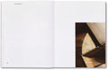 Open art book from House of Card series by MACK, showcasing colorful abstract illustrations on glossy pages.